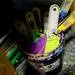 Colorful ink spatulas stored in a bucket at Underground Printing. Melanie Maxwell | AnnArbor.com